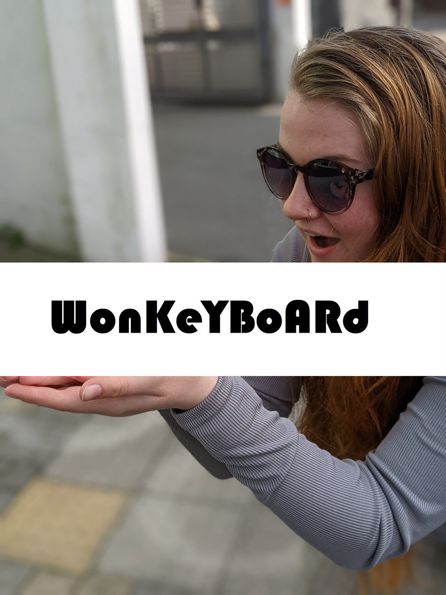 A model holding a wonkeyboard prototype, but witht the actual product obscured